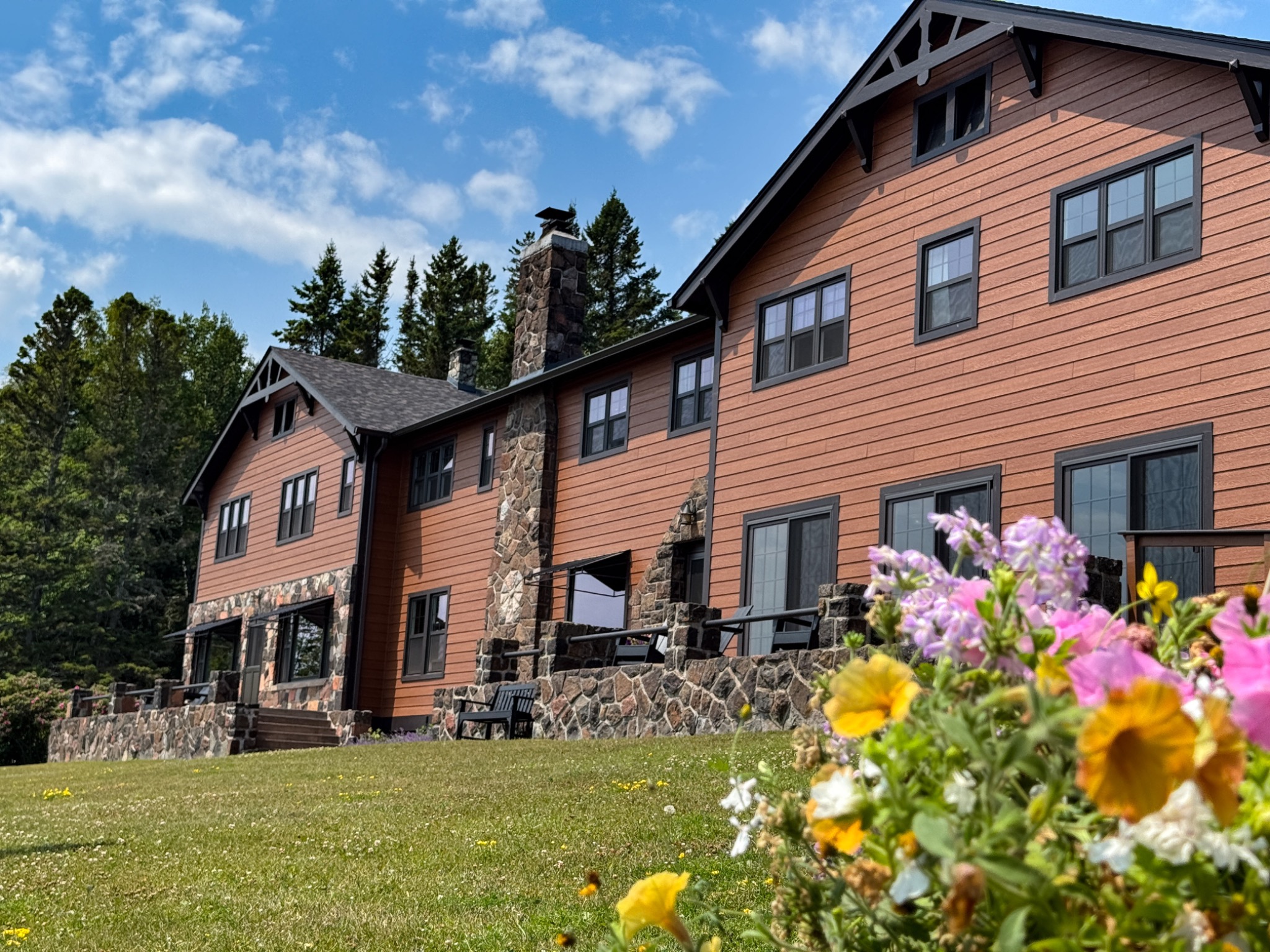 Cascade Lodge exterior with summer flowers